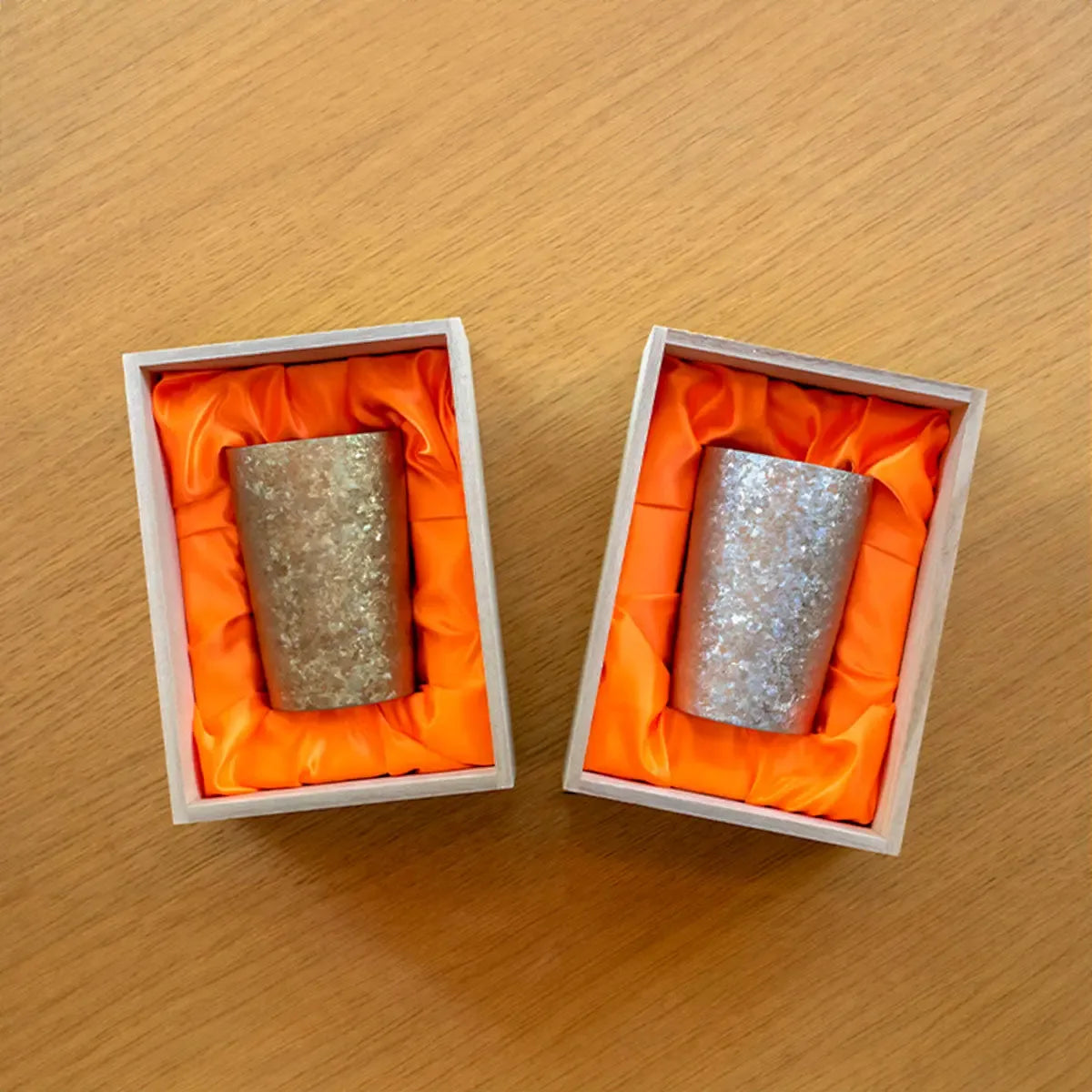 Packaging of the 270ml HORIE Kamazukuri Series Double-Walled Titanium Tumblers in gold and silver, featuring a sleek and elegant box design for both colors.