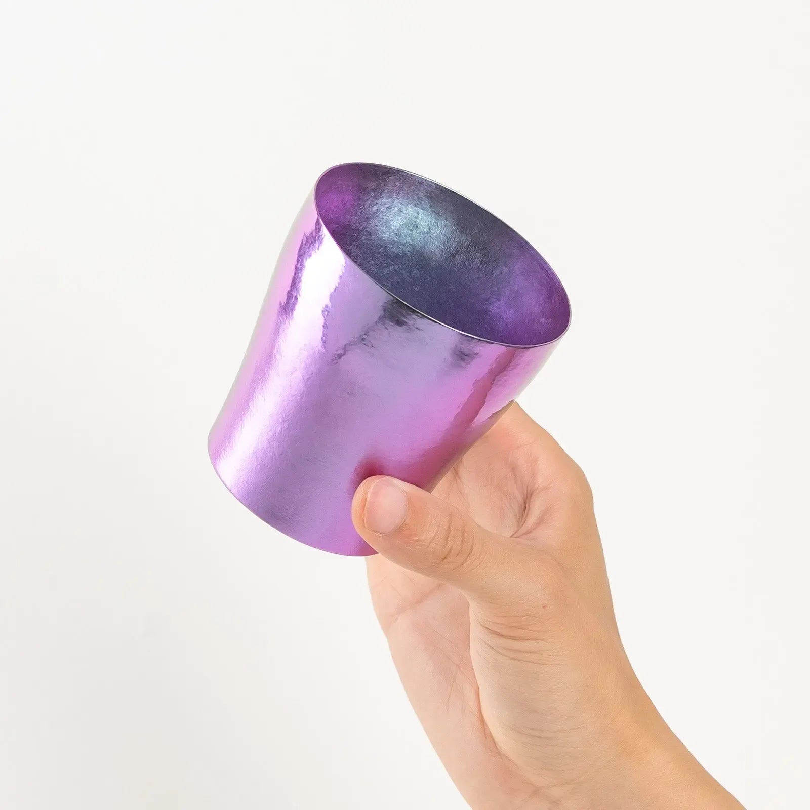 Top view of rainbow tumbler held in hand with violet gradient