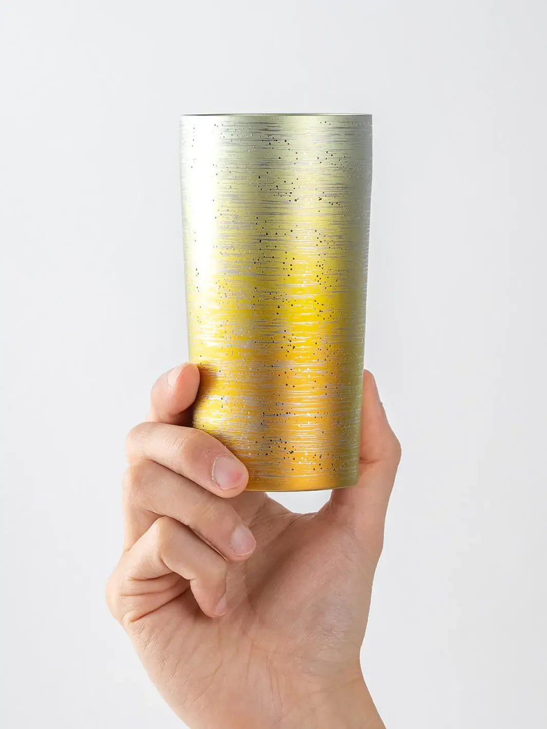 HORIE Ryo Sunset Gold titanium tumbler (350ml) held in hand, front view