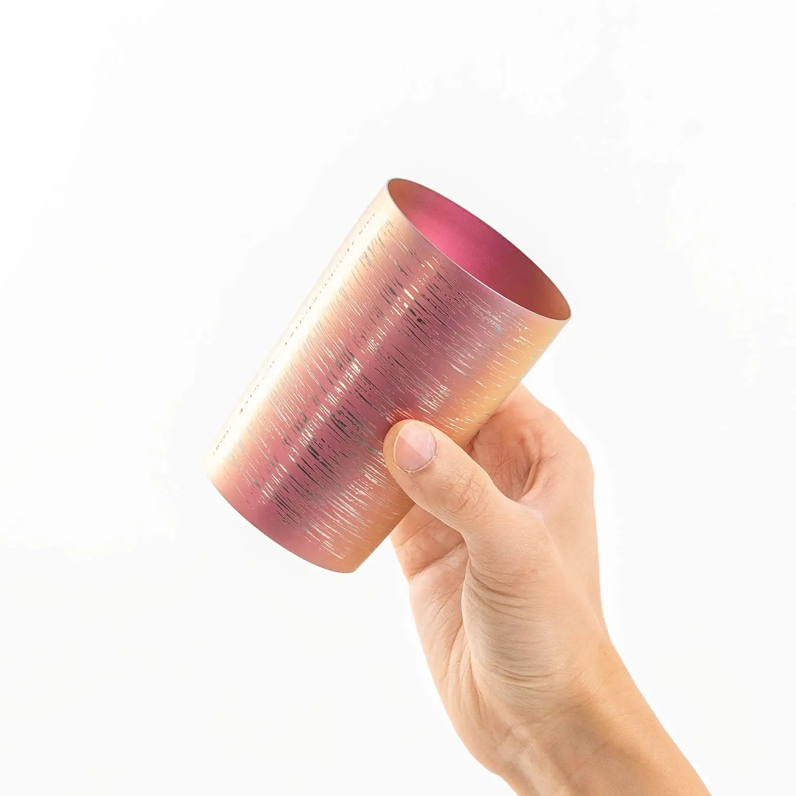 Insulated titanium tumbler 270ml pink, tilted in hand, HORIE Shirakaba Series