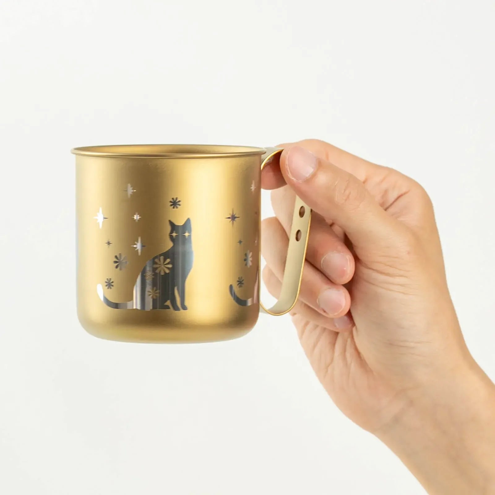HORIE cat mug held in hand, front side