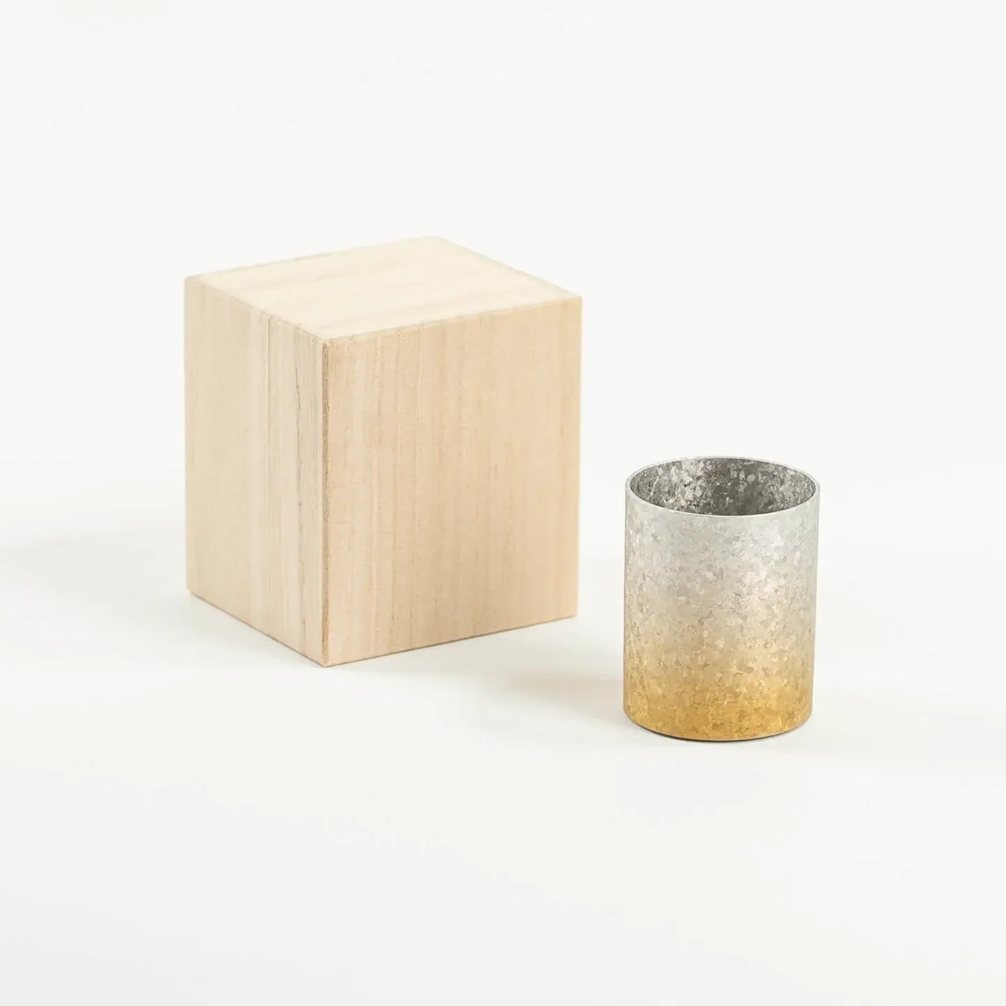 The HORIE Titanium Sake Cup (Gold & Silver Gradient) shown with its luxury paulownia wood gift box.