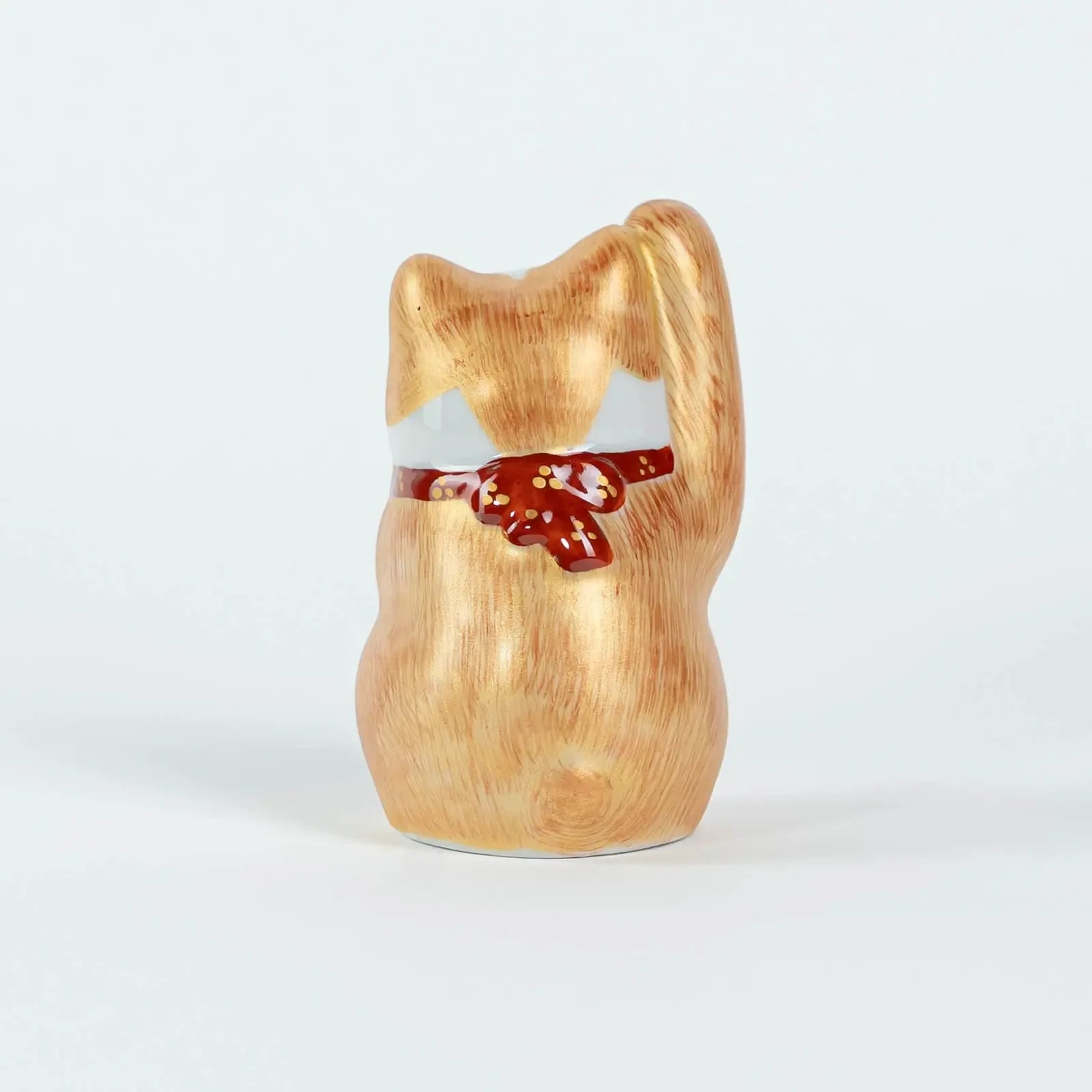 Back view of 10cm Kutani-yaki lucky cat, hand-painted ceramic figurine.