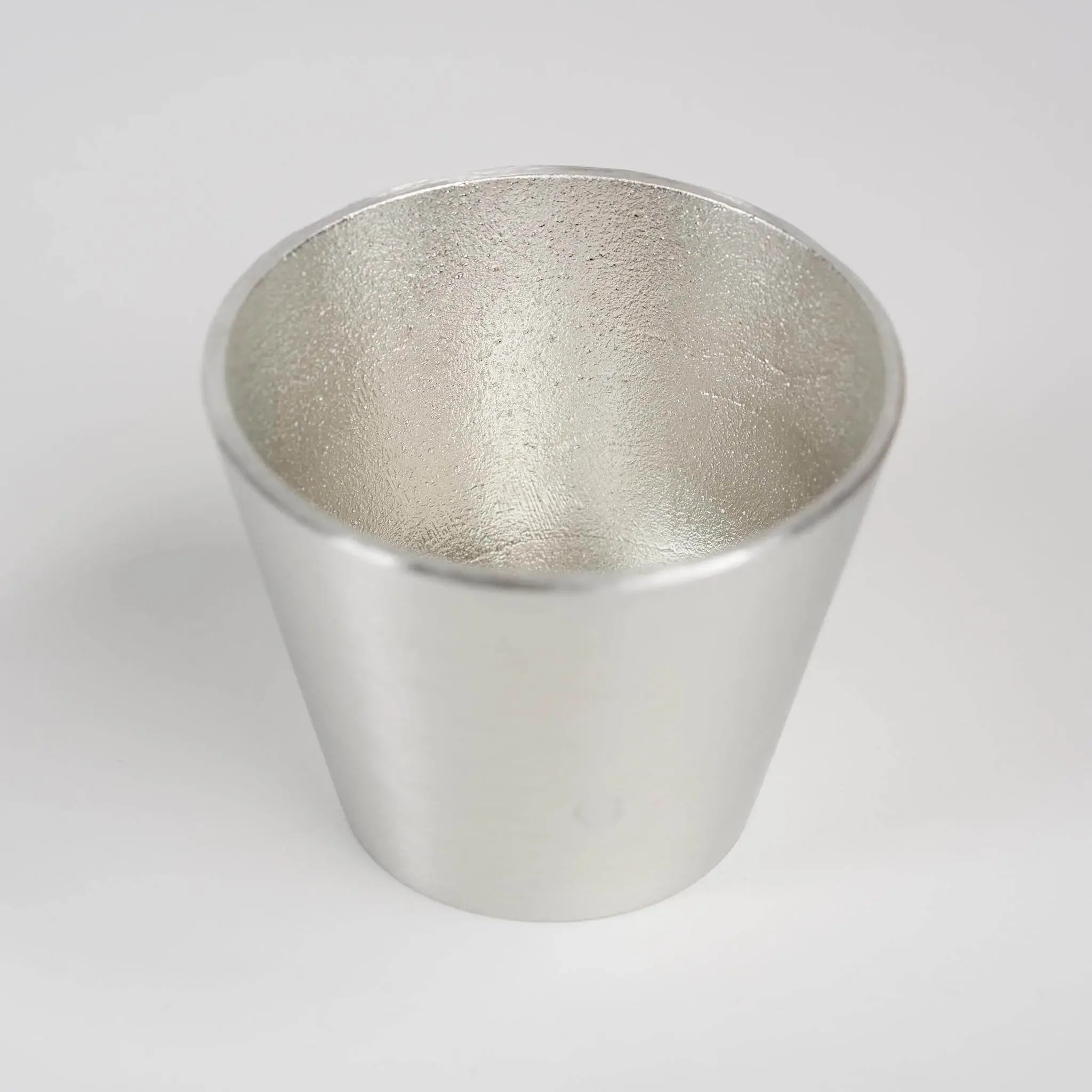 Front view of the Nousaku pure tin Guinomi sake cup before hammering.