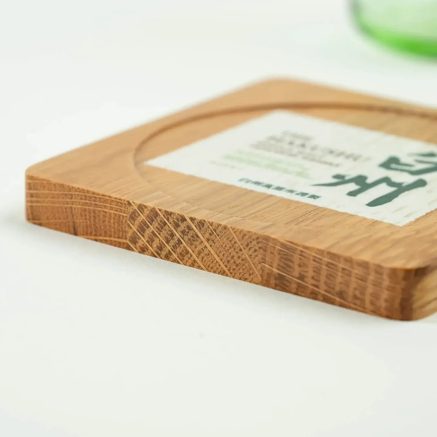 The square Hakushu cask oak coaster, featuring the classic Japanese single malt whisky label design.