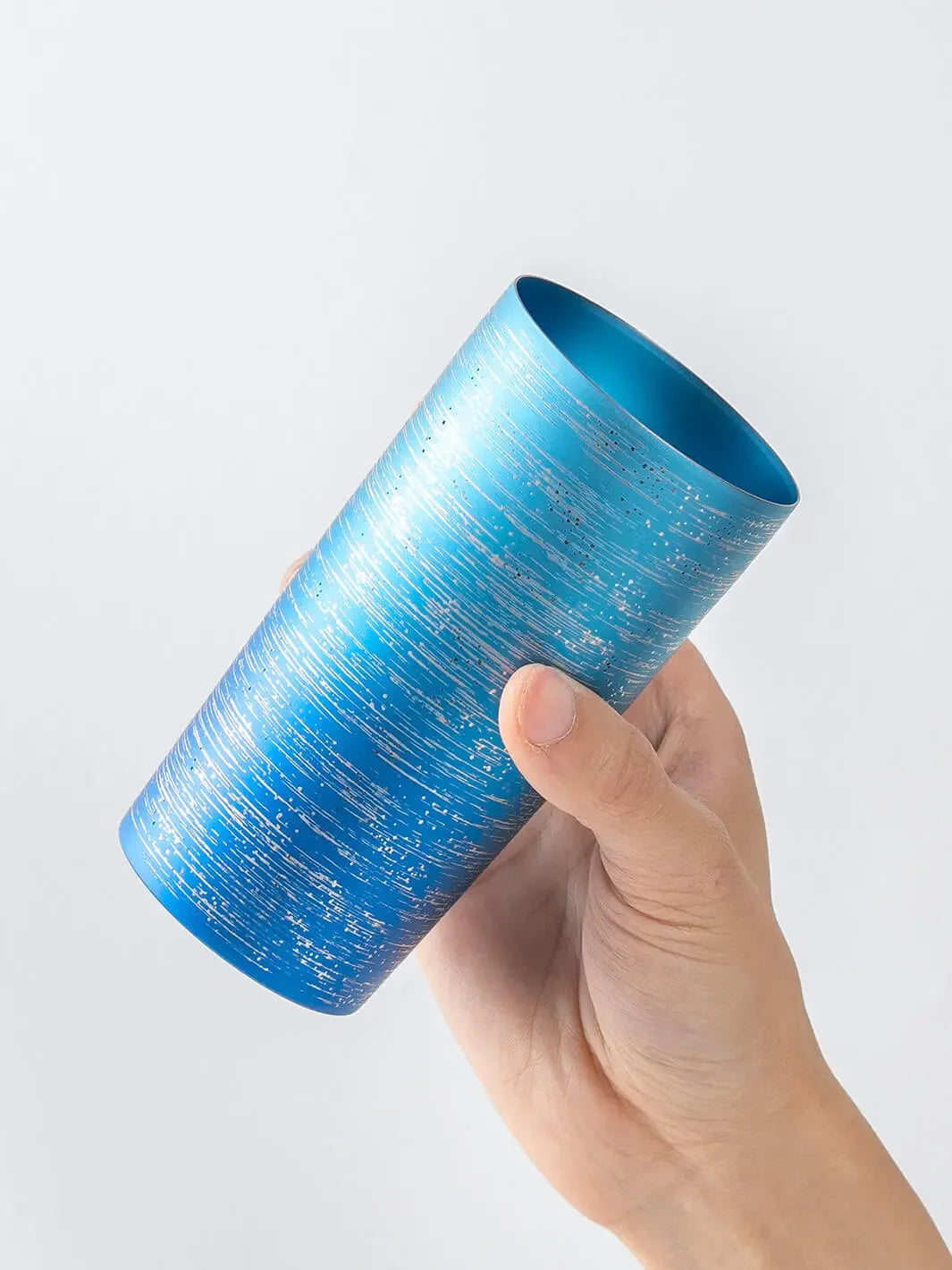 Slightly top-angled view of HORIE Ryo Ocean Blue tumbler (350ml) in hand
