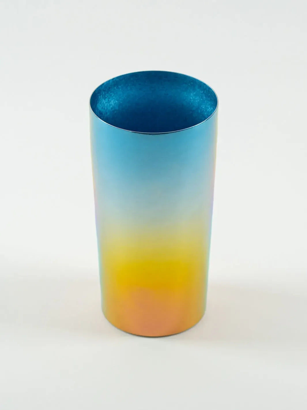 Top-angled view of HORIE Saiko rainbow titanium tumbler (350ml), showing vibrant gradient