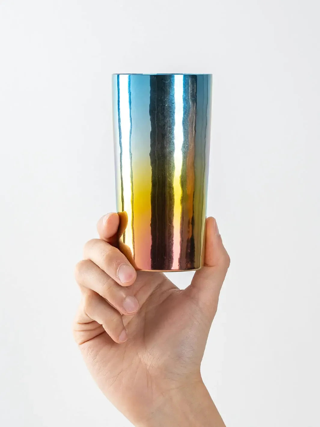 HORIE Saiko rainbow titanium tumbler (350ml) held in hand, front view