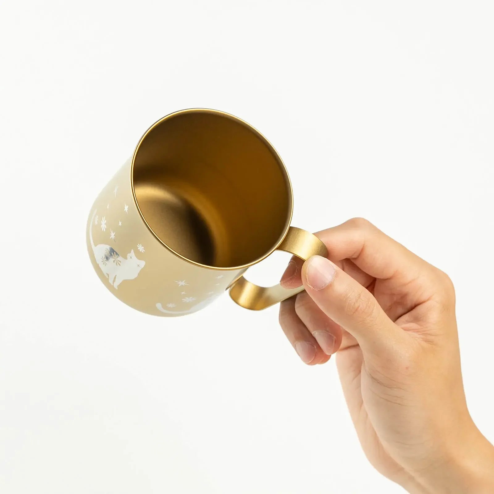 Lip of titanium mug shown in hand