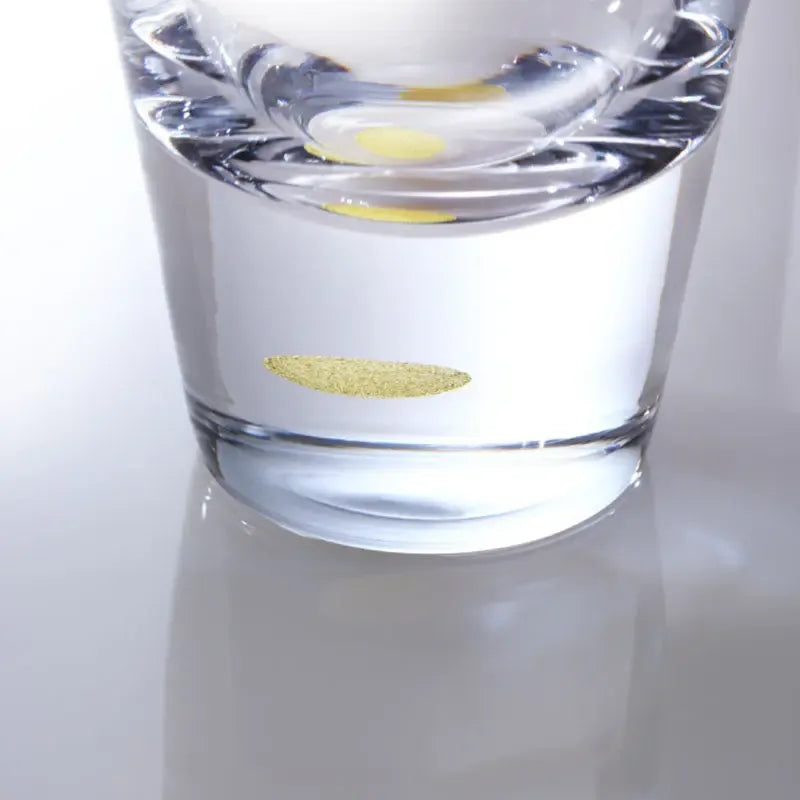 close up of gold leaf moon at the bottom of suntory x sghr tsukimi rock glass