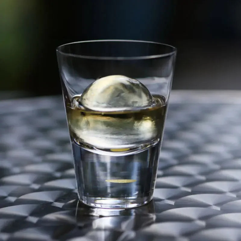 top view of suntory x sghr tsukimi rock glass showing gold leaf moon design