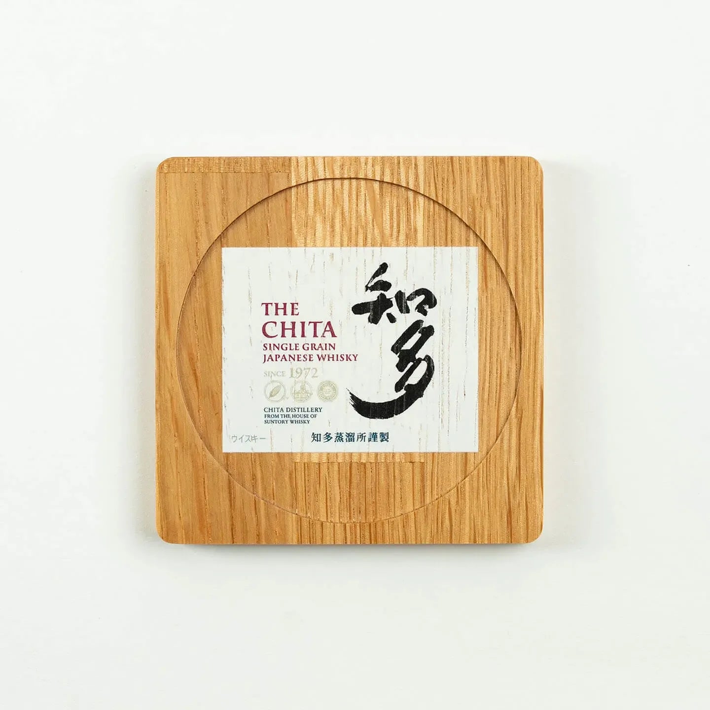 The square The Chita cask oak coaster, featuring the classic Japanese single grain whisky label design.