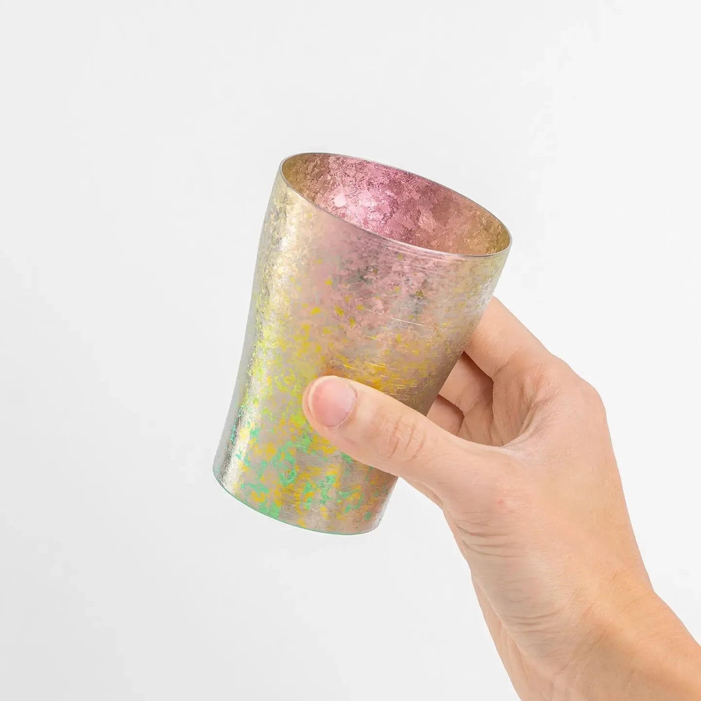 Side view of pink tumbler in hand