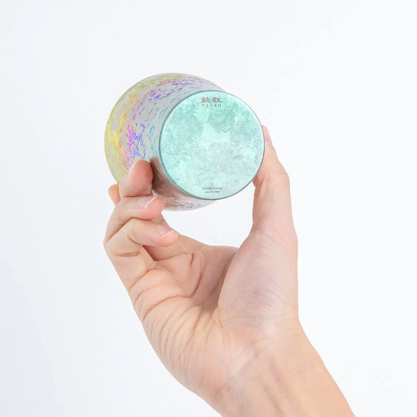 Close-up of the tumbler's bottom, showing the "Taiko" and "HORIE TITANIUM made in Japan" branding.