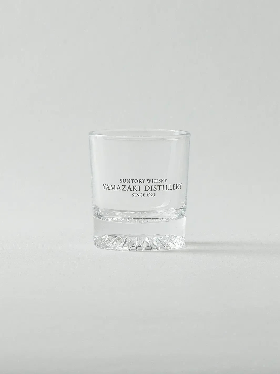 Empty Japanese whiskey shot glass from Yamazaki, front view