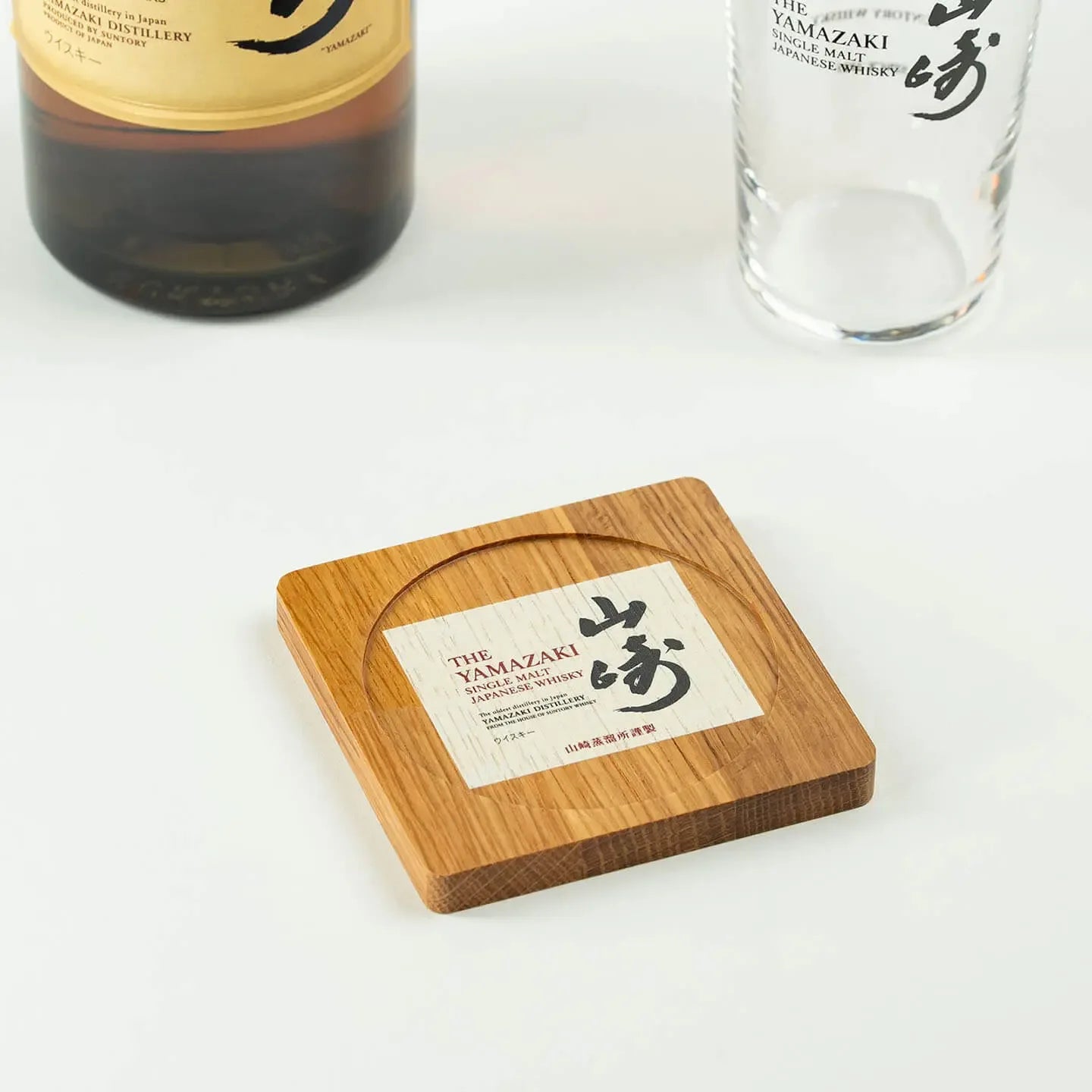 The square Yamazaki cask oak coaster, featuring the classic Japanese single malt whisky label design.